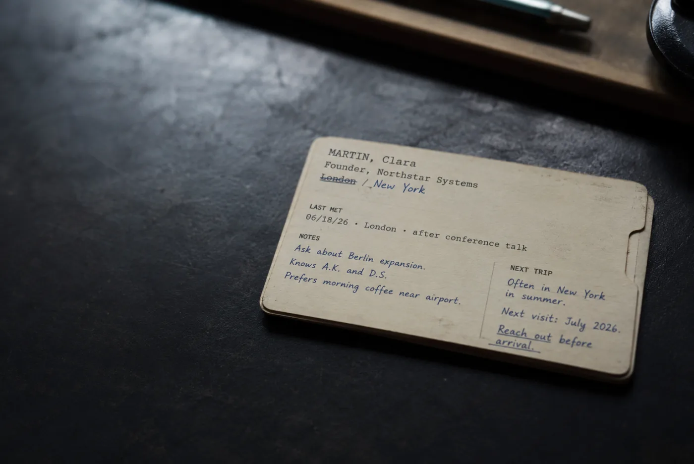 A single contact card showing a person's cities, the date and place they last met, notes, and their next trip